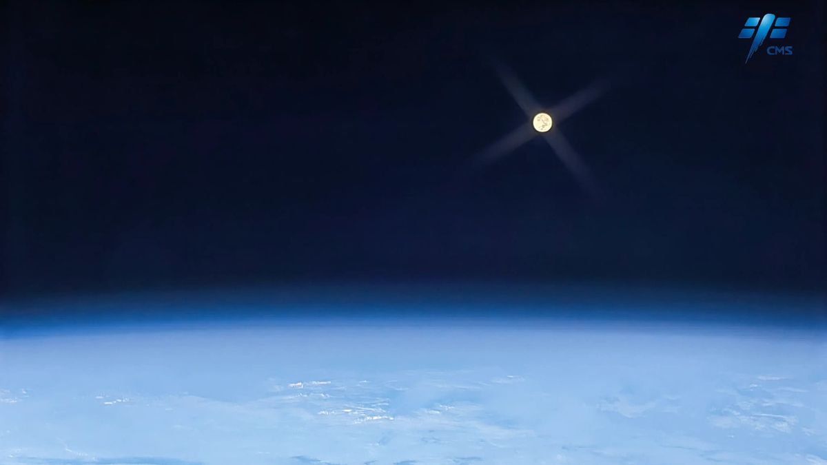 A full, distant moon imaged above Earth, taken by Liu Yang.