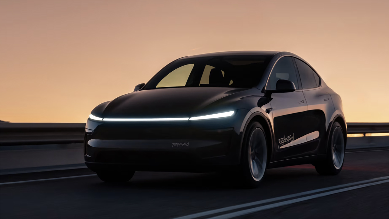 Tesla Robotaxi vehicle against setting sun backdrop