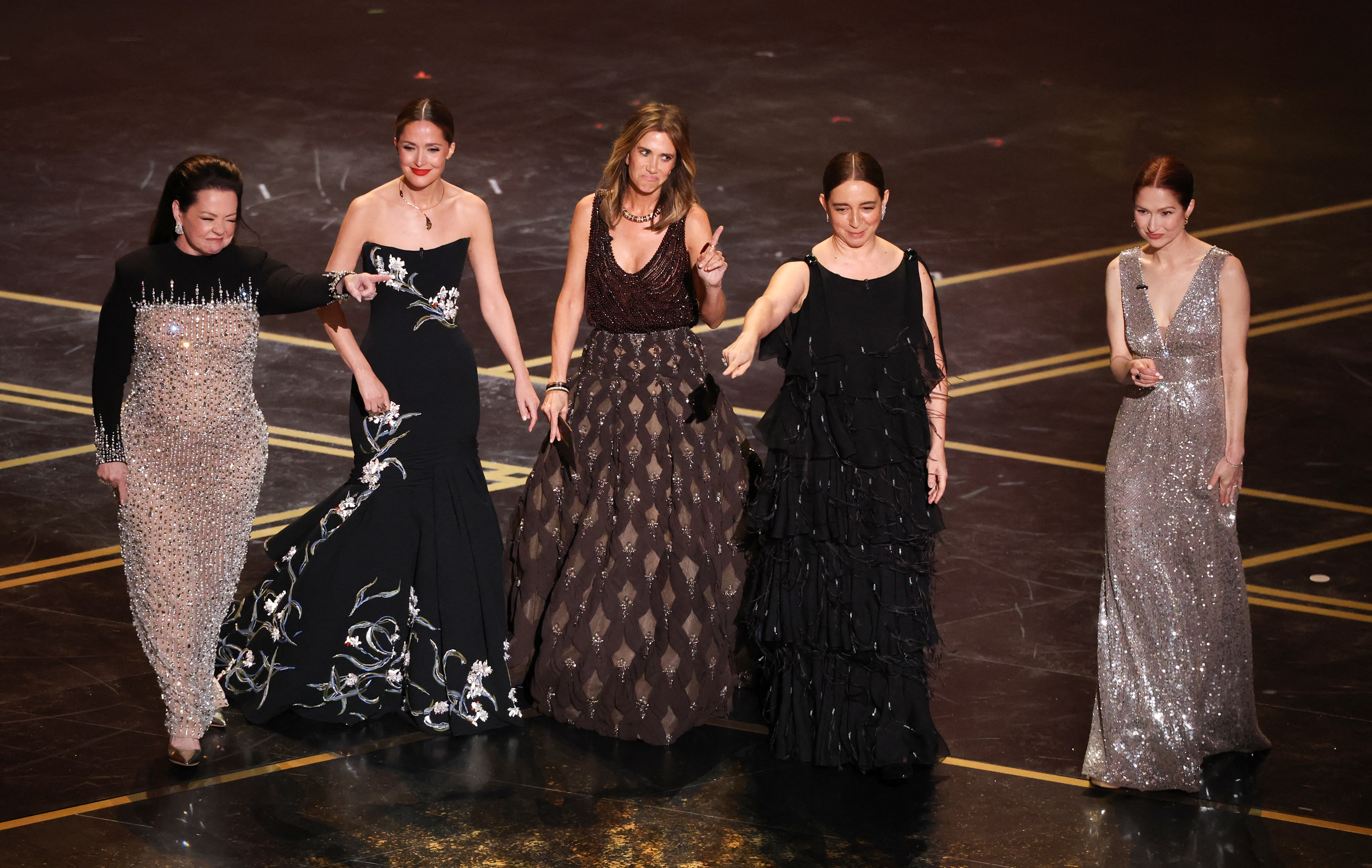 bridesmaids stars reunite at the oscars as actress Melissa Mccarthy, actress Rose Byrne, actress Kristen Wiig, actress Maya Rudolph and actress Ellie Kemper arrive onstage to present the award for Best Music (Original Score) during the 98th Annual Academy Awards at the Dolby Theatre in Hollywood, California on March 15, 2026