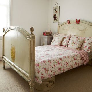 bedroom with white wall and antique bed