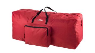 A red duffle-like Christmas tree storage bag with a zipped front pocket, for the best Christmas tree storage bags.
