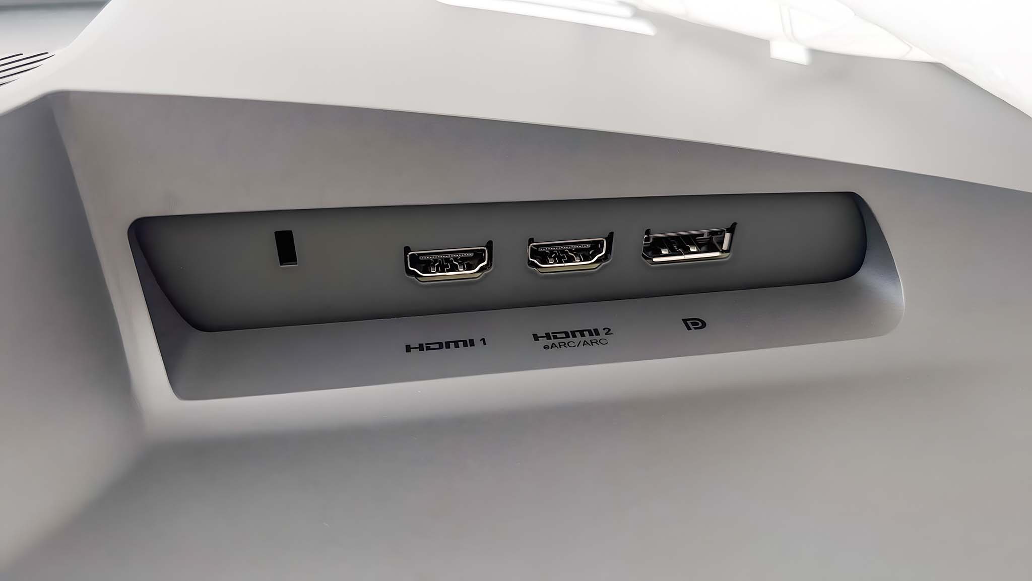 Closeup of the Kensington lock, two HDMI ports, and a DisplayPort port on the Alienware AW2725QF Gaming Monitor.