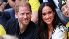 Prince Harry, Duke of Sussex and Meghan, Duchess of Sussex pose for a photograph as they attend the Wheelchair Basketball 