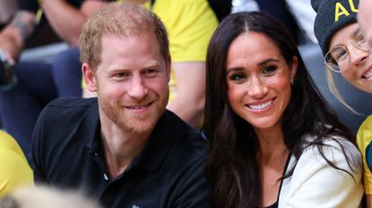 Prince Harry, Duke of Sussex and Meghan, Duchess of Sussex pose for a photograph as they attend the Wheelchair Basketball 