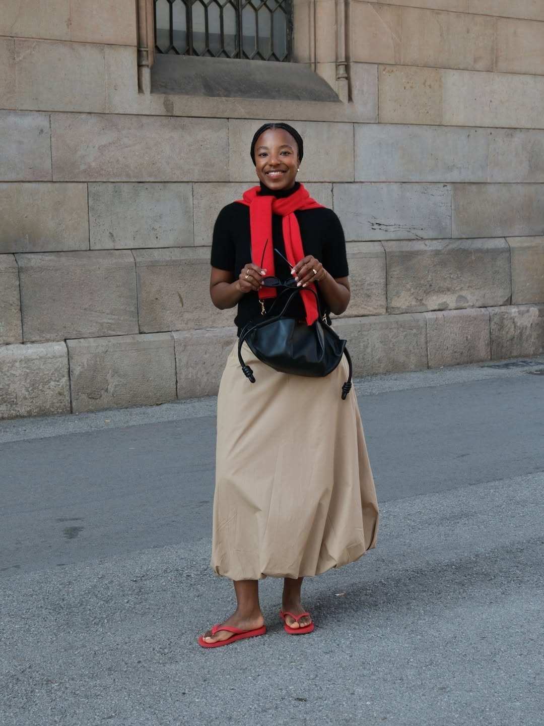 Taffy in beige skirt and red flip-flops