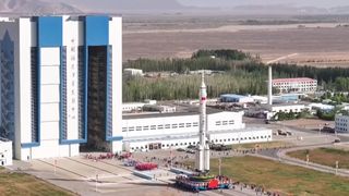 The Long March 2F rocket for China's Shenzhou 23 astronaut mission rolls out to the launch pad on May 16, 2026.