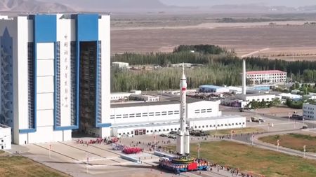 The Long March 2F rocket for China's Shenzhou 23 astronaut mission rolls out to the launch pad on May 16, 2026.