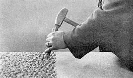 chiseling artist