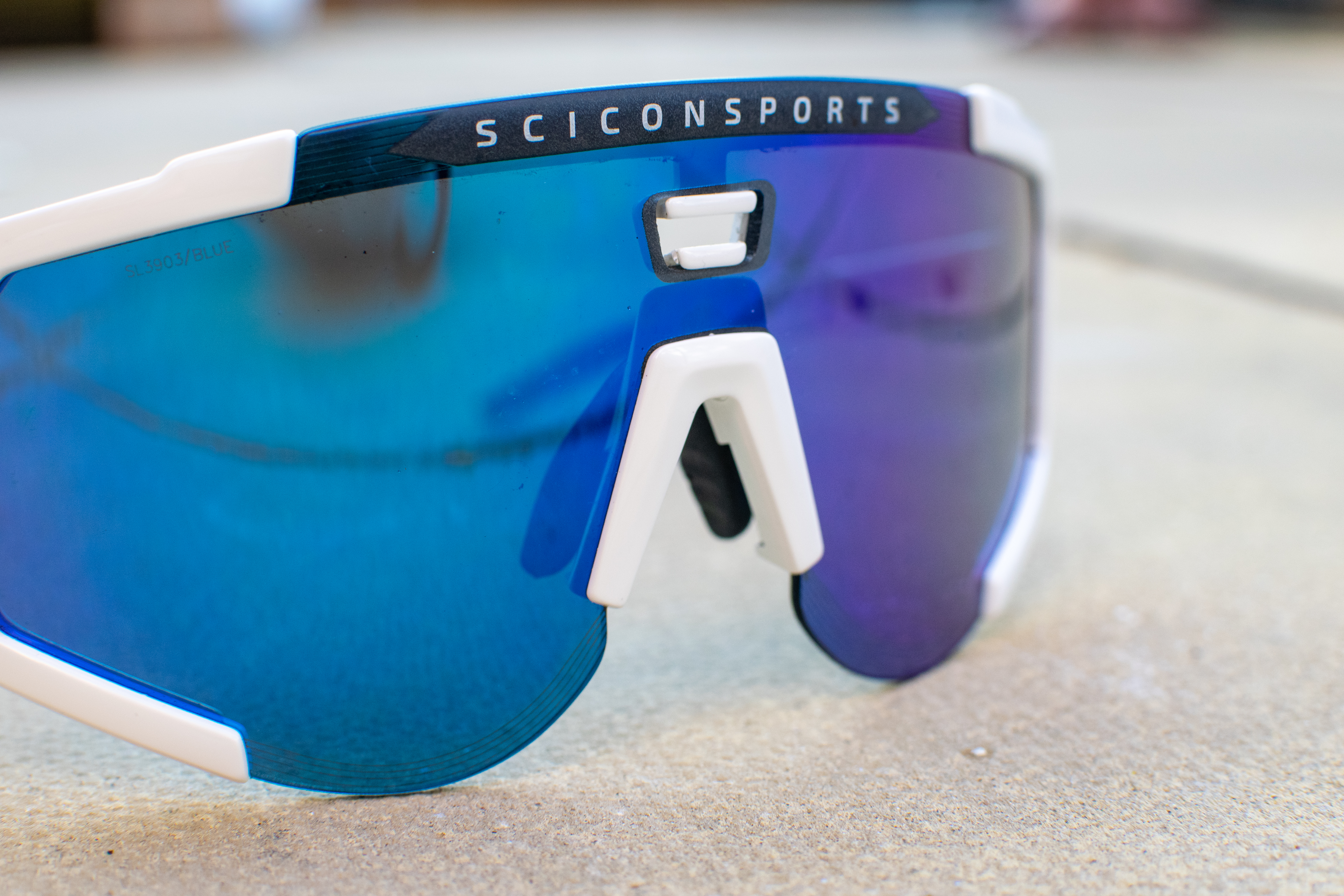 A pair of blue and white scicon aeroscope sunglasses
