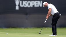 Wyndham Clark hits a putt