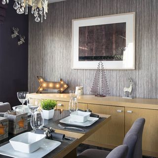 dining room with feature wall and dining table