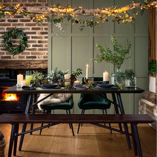 brown dinning table and chair with christmas decor and brick wall