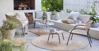 outdoor living area style with luxury furniture and rugs as part of the quiet luxury garden trend