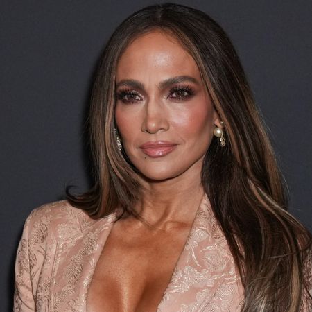 Jennifer Lopez wears a vintage Jean Paul Gaultier blazer with a spin on the lace skirt trend