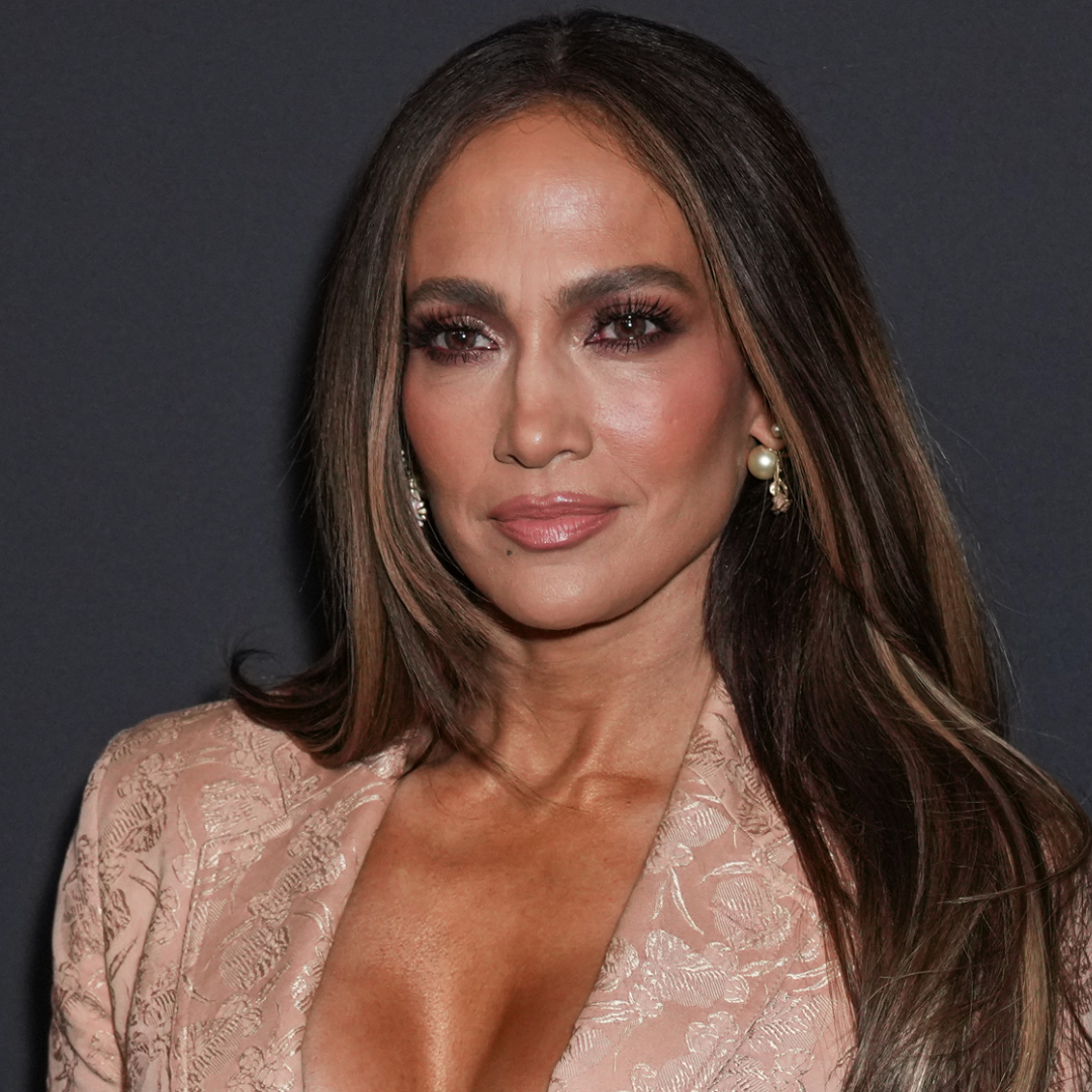 Jennifer Lopez wears a vintage Jean Paul Gaultier blazer with a spin on the lace skirt trend