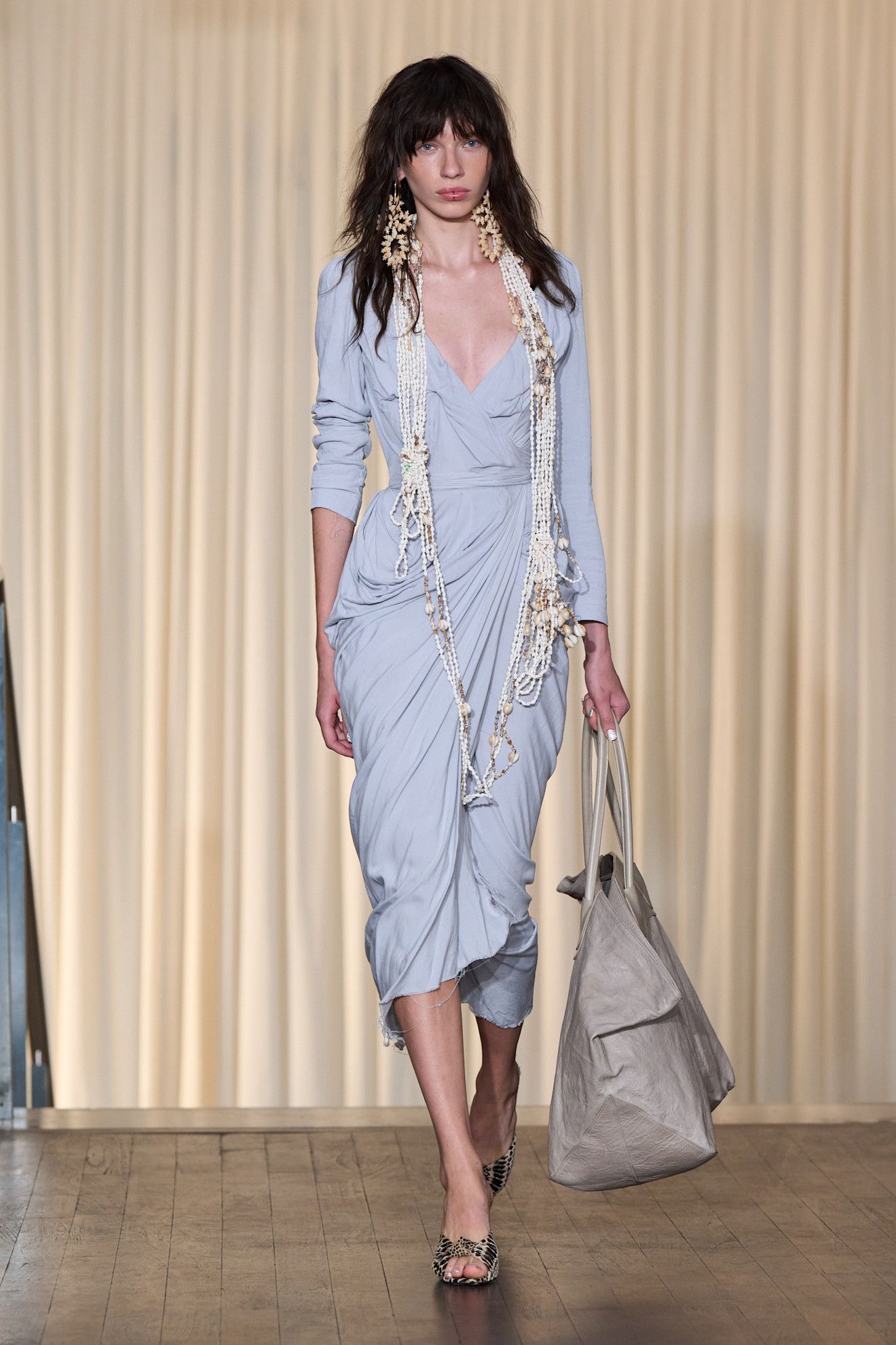 Model wears the baby blue color trend on the runway.