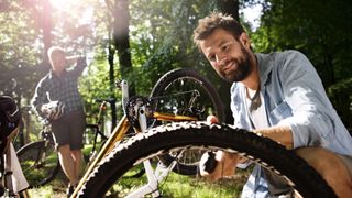 Man pumping a bike tire