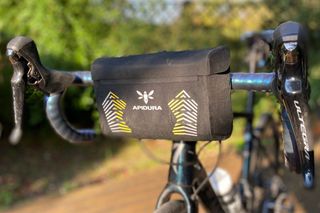 Image shows the Apidura Racing Handlebar Mini Pack which is one of the best bike handlebar bags