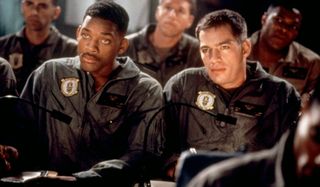 Independence Day Will Smith and Harry Connick Jr side by side in a briefing