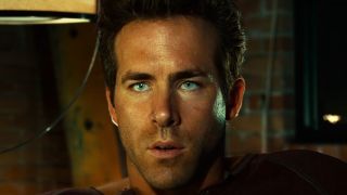 Ryan Reynolds with sharp green eyes in Green Lantern