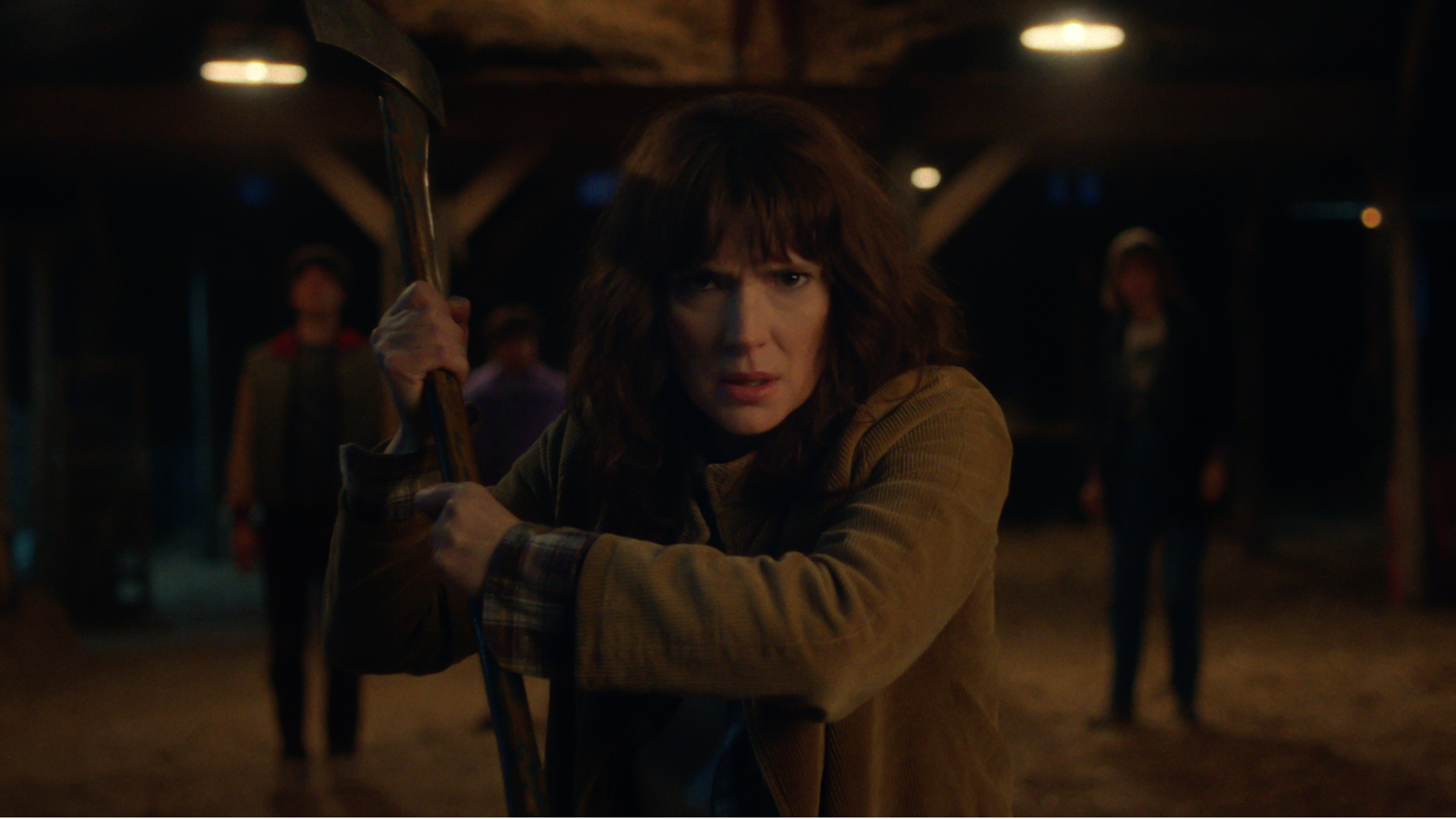 winona ryder as joyce byers preparing to fight something in stranger things season 5