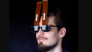 A man wears strange looking VR glasses
