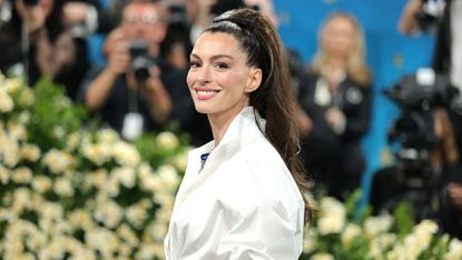Anne Hathaway attends the 2025 Met Gala Celebrating "Superfine: Tailoring Black Style" at Metropolitan Museum of Art on May 05, 2025 in New York City