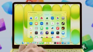 A citrus MacBook Neo laptop displaying Microsoft apps