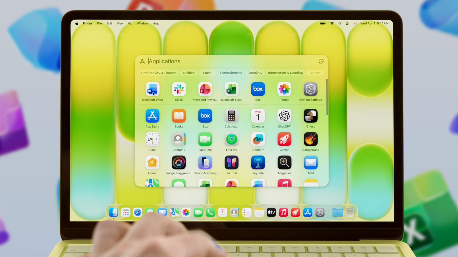 A citrus MacBook Neo laptop displaying Microsoft apps