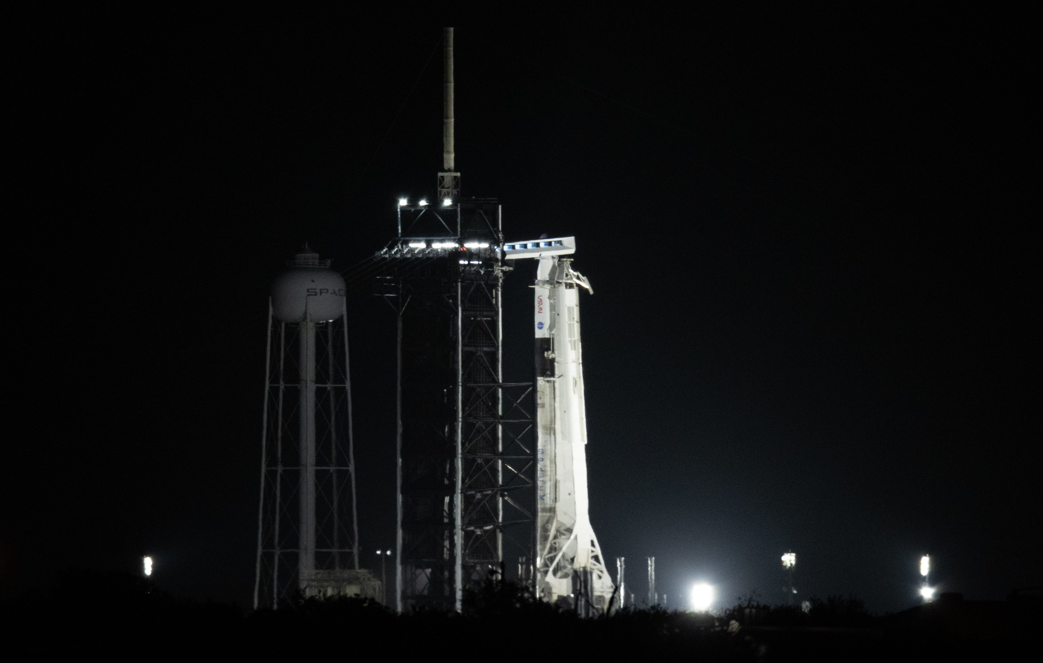 A SpaceX Falcon 9 rocket with the company's Crew Dragon spacecraft onboard is seen illuminated by spotlights on the launch pad at Launch Complex 39A as the countdown continues for the launch of the Crew-2 mission, Friday, April 23, 2021, at NASA’s Kennedy Space Center in Florida.
