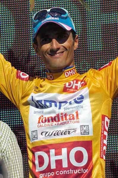 The golden jersey looks good on Bennati and his smile.
