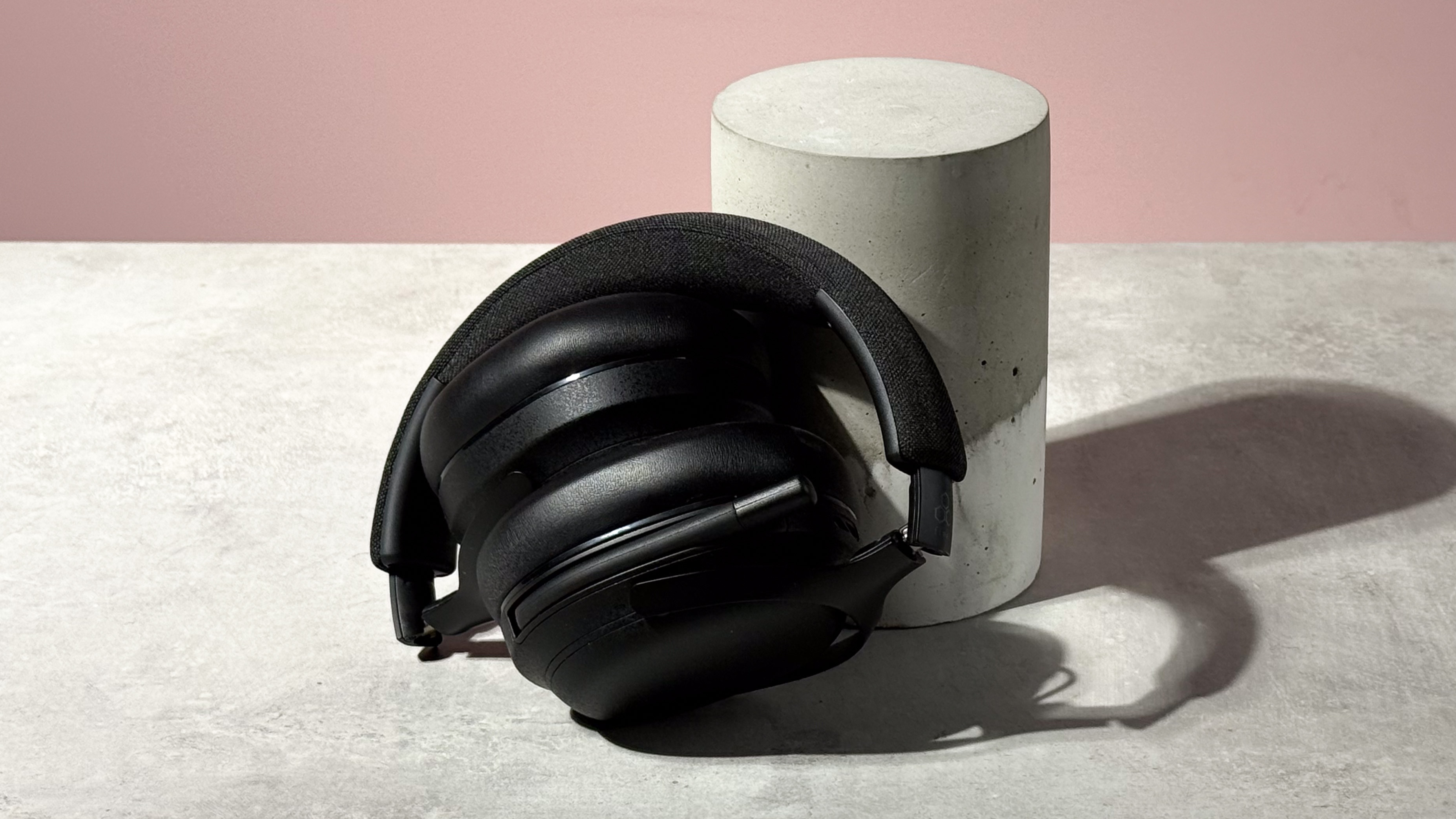 The Final VR3000 EX for Gaming folded up and leant against a stone and concrete cylinder.