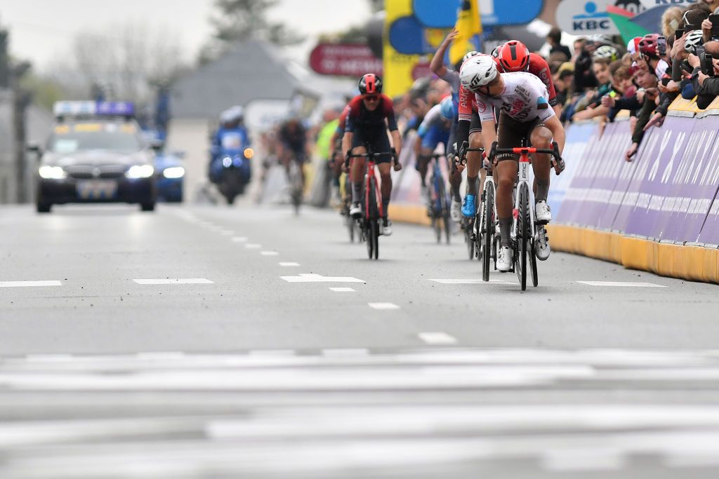 OVERIJSE BELGIUM APRIL 13 LR Tim Wellens of Belgium and Team Lotto Soudal Warren Barguil of France and Team Arka Samsic and Benoit Cosnefroy of France and AG2R Citren Team cross the finish line during the 62nd De Brabantse Pijl La Flche Brabanonne 2022 Mens Elite a 2051km one day race from Leuven to Overijse BP22 on April 13 2022 in Overijse Belgium Photo by Luc ClaessenGetty Images