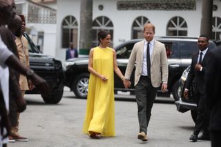 Meghan (L), Duchess of Sussex, and Britain's Prince Harry (R), Duke of Sussex arrive at the State Governor House in Lagos on May 12, 2024 as they visit Nigeria as part of celebrations of Invictus Games anniversary.