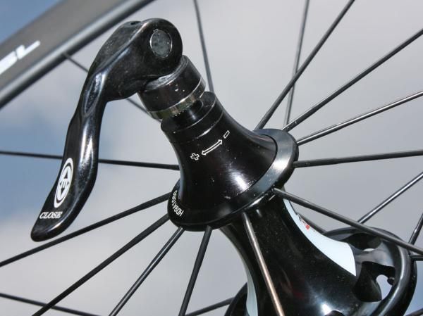 The rear hub's bearing adjustment requires you to loosen the end caps first