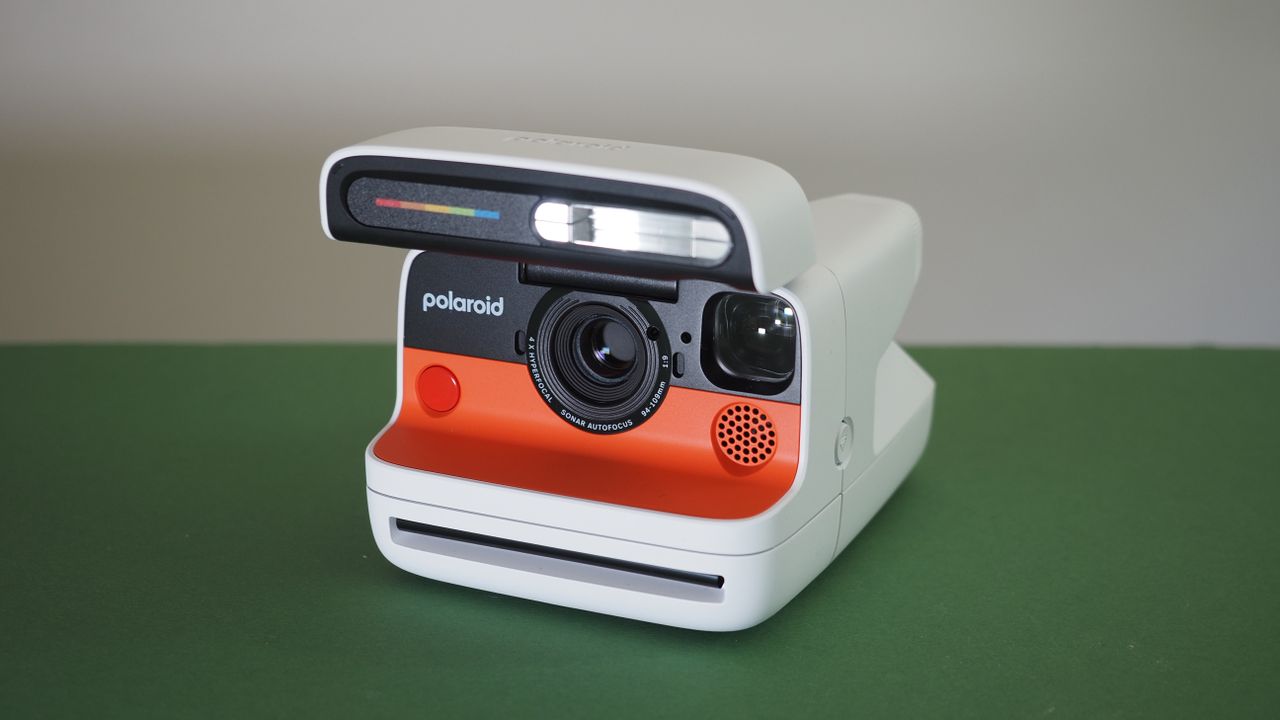 Polaroid Flip camera on a green surface