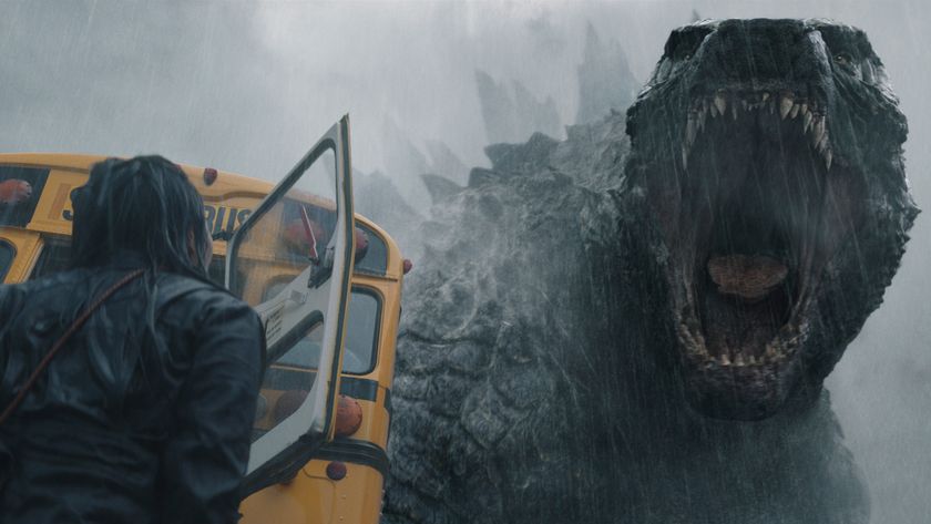 Godzilla roars at a person who&#039;s standing next to a school bus in Monarch: Legacy of Monsters