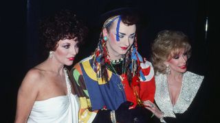Boy George wearing colorful mascara with Joan Collins and Joan Rivers