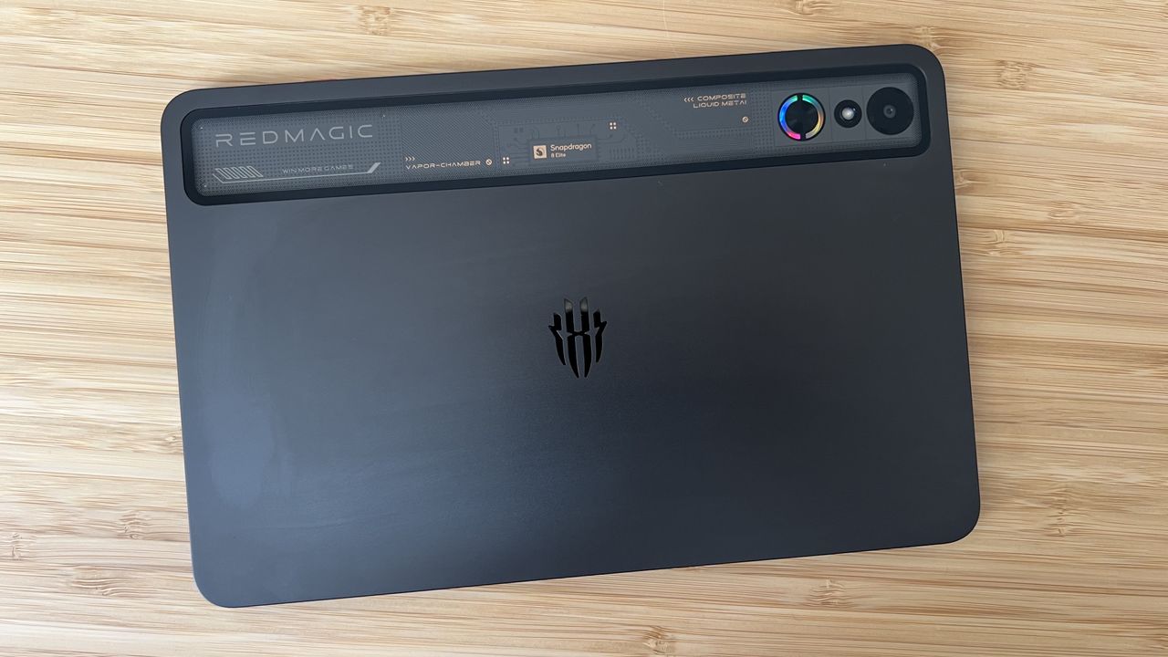 Back panel of RedMagic Astra gaming tablet on a wooden desk