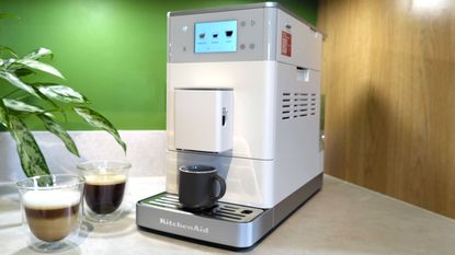 KitchenAid KF4 espresso machine with coffee drinks on kitchen counter