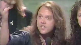 Lars Ulrich giving a speech onstage in 1992