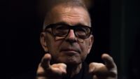 American historic producer of British singer David Bowie, Tony Visconti, poses during a photo session in Paris on November 19, 2019