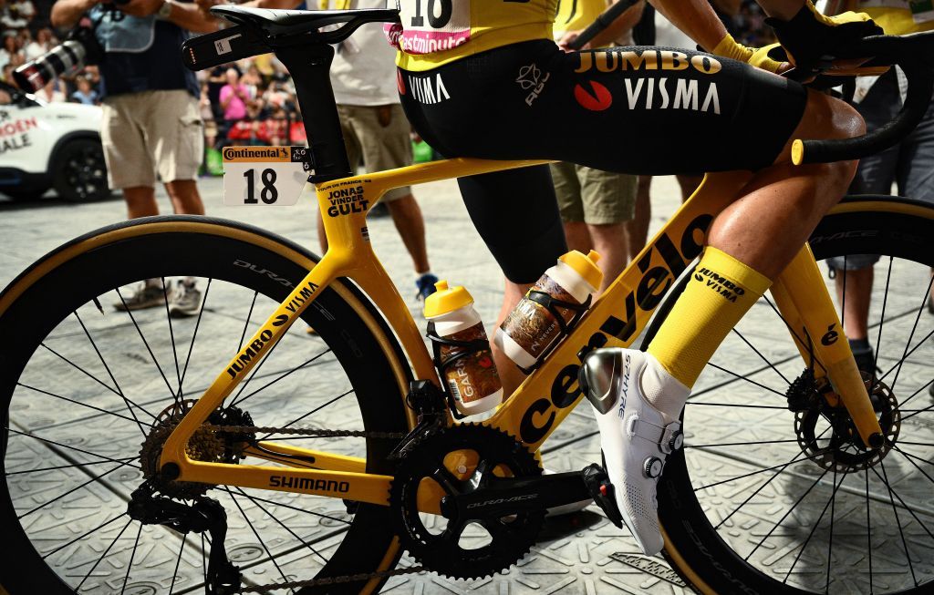 JumboVisma teams Danish rider Jonas Vingegaard wearing the overall leaders yellow jersey sits on his bicycle as he awaits the start of the 21st and final stage of the 109th edition of the Tour de France cycling race 1156 km between La Defense Arena in Nanterre outside Paris and the ChampsElysees in Paris France on July 24 2022 Photo by Marco BERTORELLO AFP Photo by MARCO BERTORELLOAFP via Getty Images