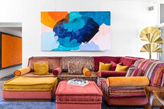a colorful sofa in a living room