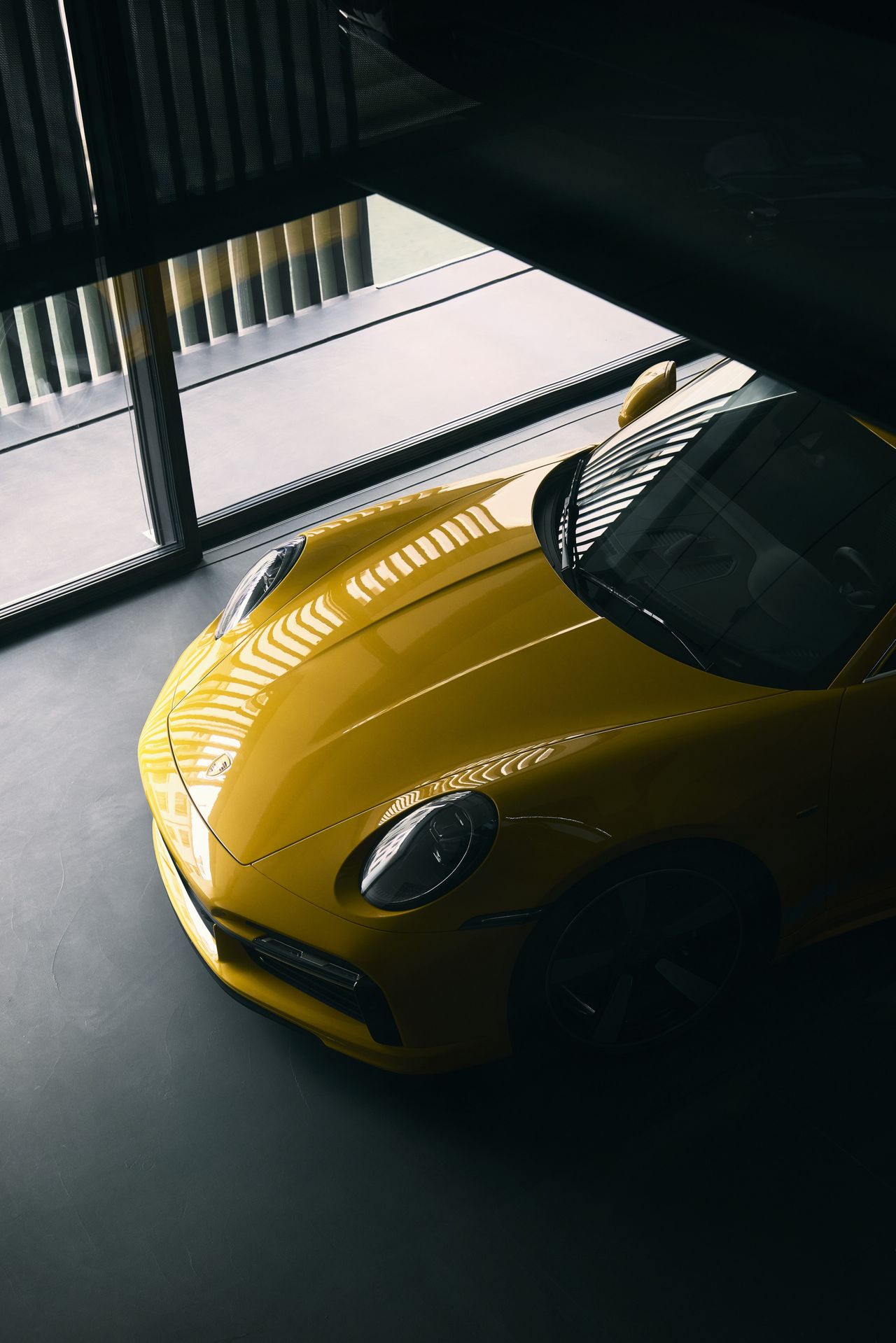 The building creates unique vistas for viewing the car collection