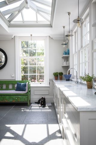 Martin Moore Stone flagstone in white kitchen with green bench