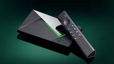 Nvidia Shield TV Pro with remote on a dark green background
