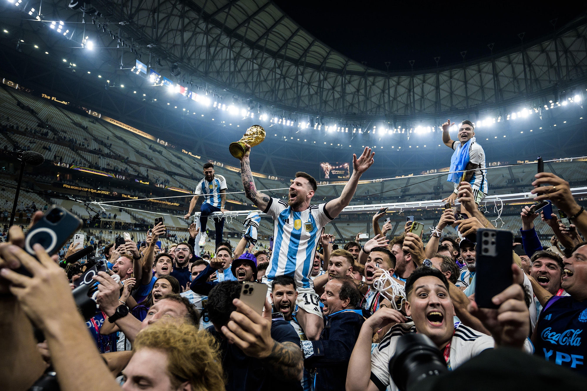 Joel Marklund photograph of the World Cup 2022 showing Lionel Messi holding World Cup aloft among fans