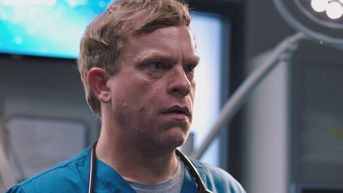 Dylan Keogh at work looking shocked because he is in danger in Casualty&#039;s Public Property finale, Just Like Us. 