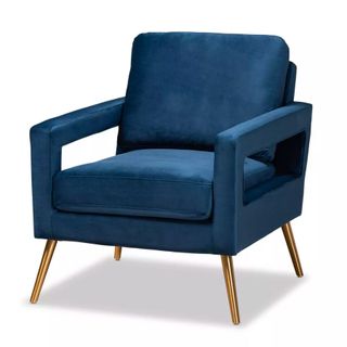 A blue velvet accent chair